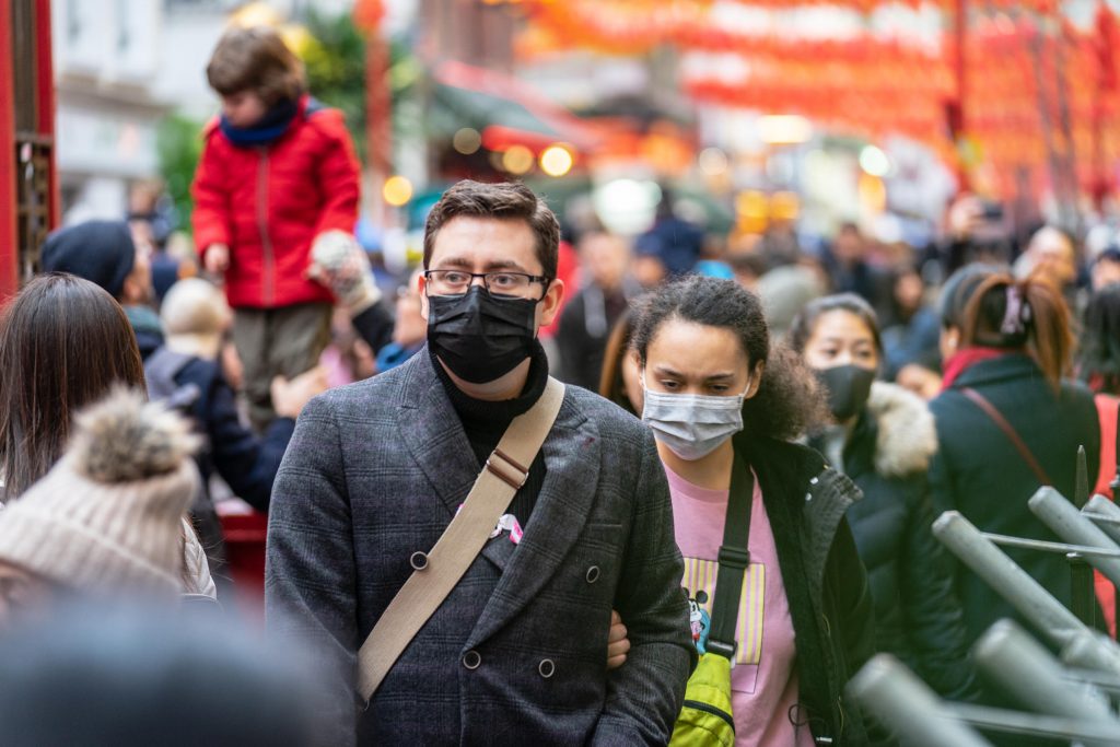 People wearing a face masks to protecting themself because of epidemic in China. Selective Focus. Concept of coronavirus quarantine. Coronavirus update